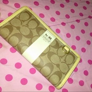 Tan and white leather coach wallet